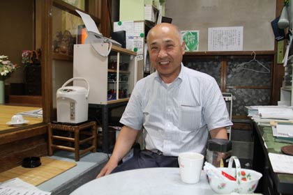 「酒のニラサワ」社長で四日町商店街会長の韮沢隆行さん