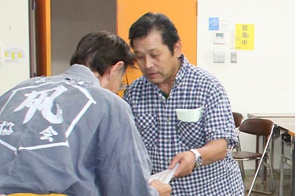 推薦で表彰を受ける岡田達雄さん