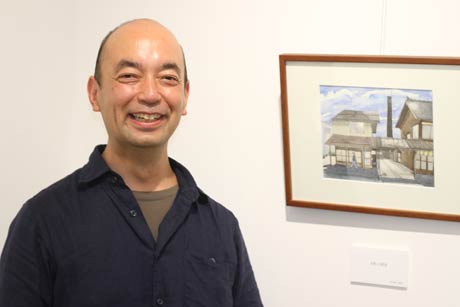 会場の野田英世さん