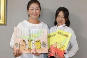 絵本「燕三条ラーメン王国物語」とカレーラーメン体操マスターの2人