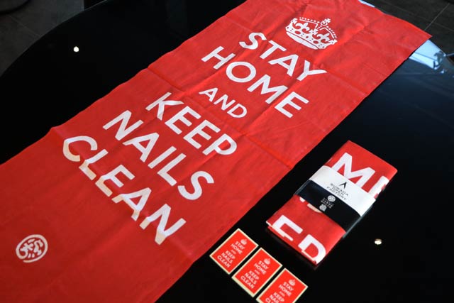 「STAY HOME AND KEEP NAILS CLEAN」の手ぬぐいとステッカー